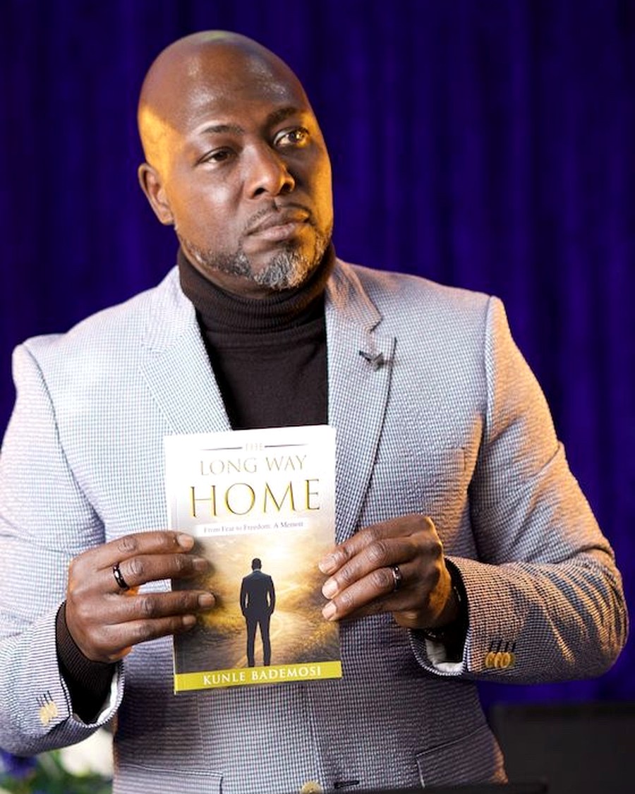 Kunle holding The Long Way Home